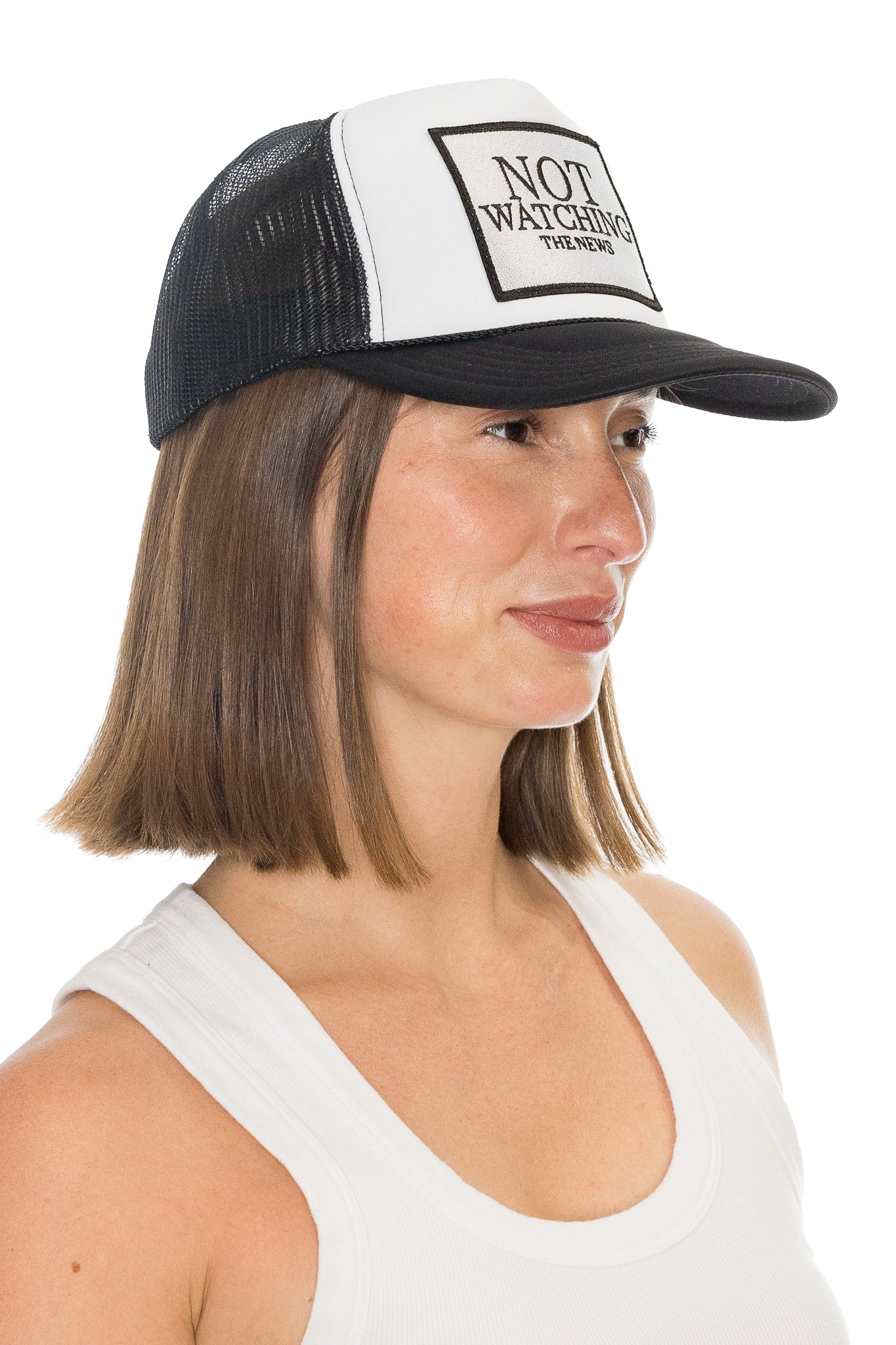 Not Watching The News Trucker Hat in Black and White Split