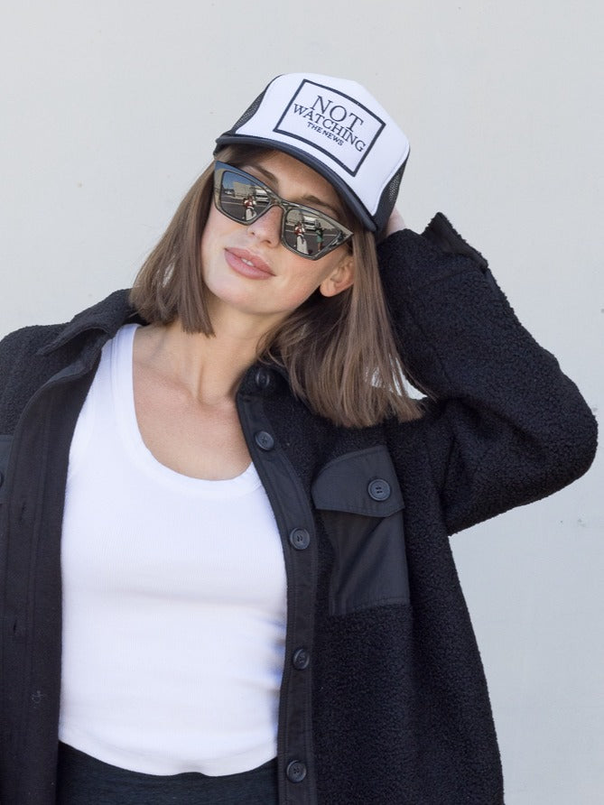 Not Watching The News Trucker Hat in Black and White Split
