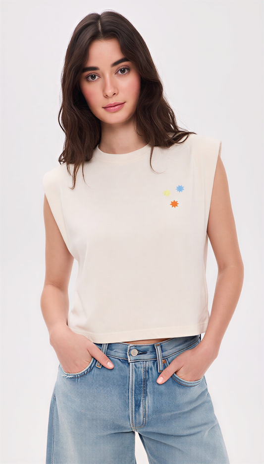Cream Star Born muscle tank, front view with small screen printed star cluster on the chest
