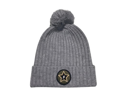 Women's beanie with a puff top and patch front, offering stylish warmth for chilly days